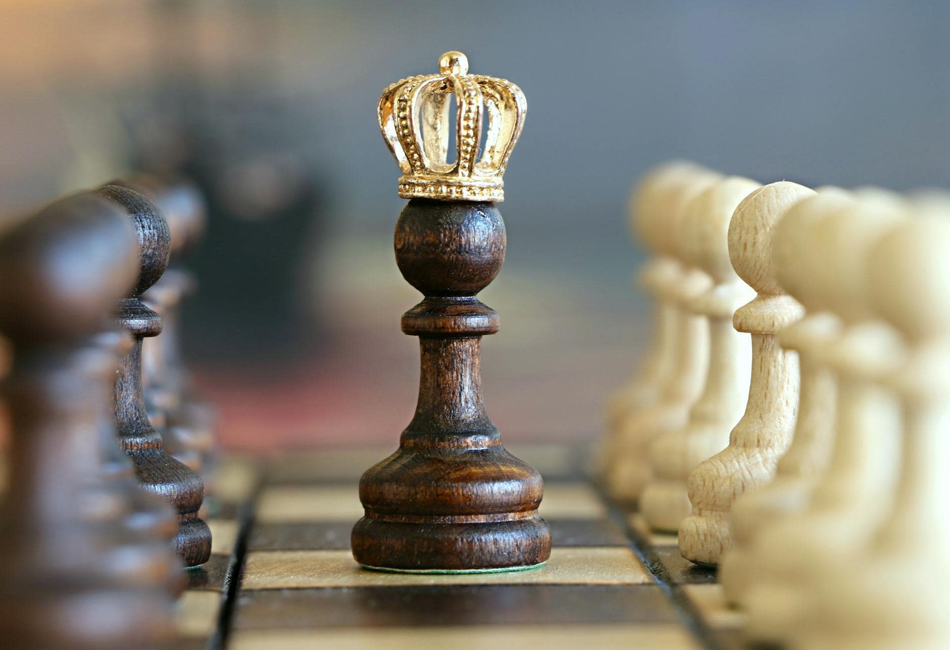 King chess piece with a crown symbolizing leadership and strategic thinking in conflict resolution.
