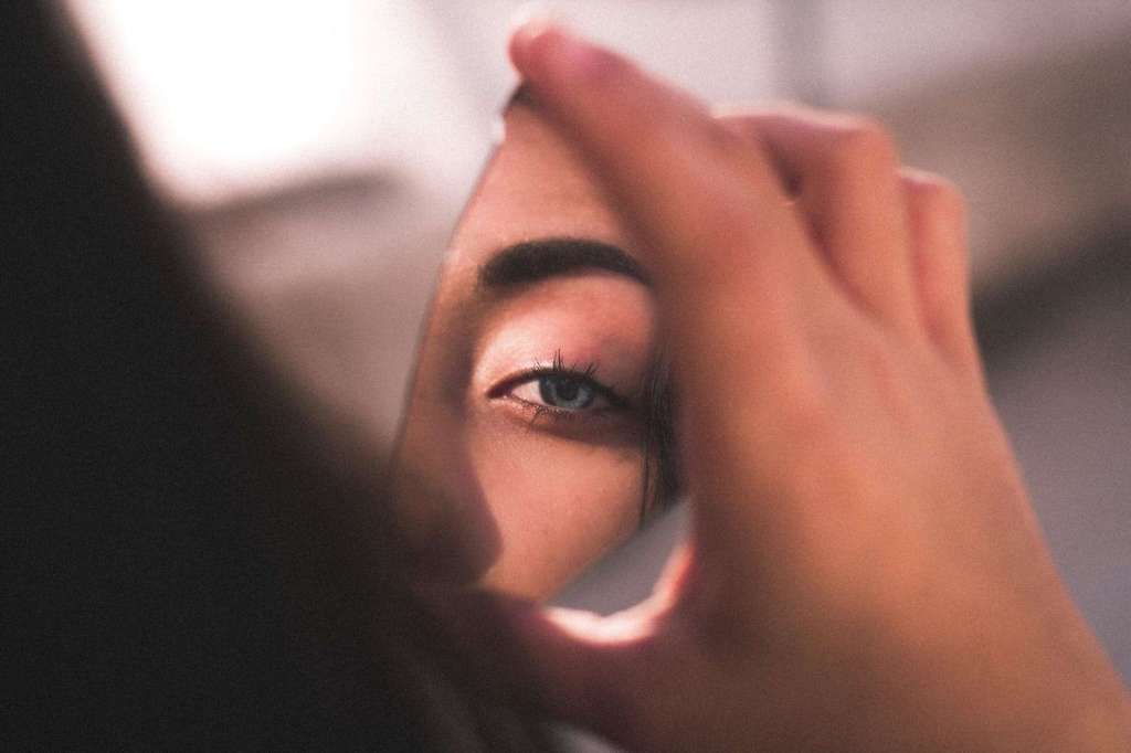 Close-up of a woman practicing self-reflection and mindfulness.