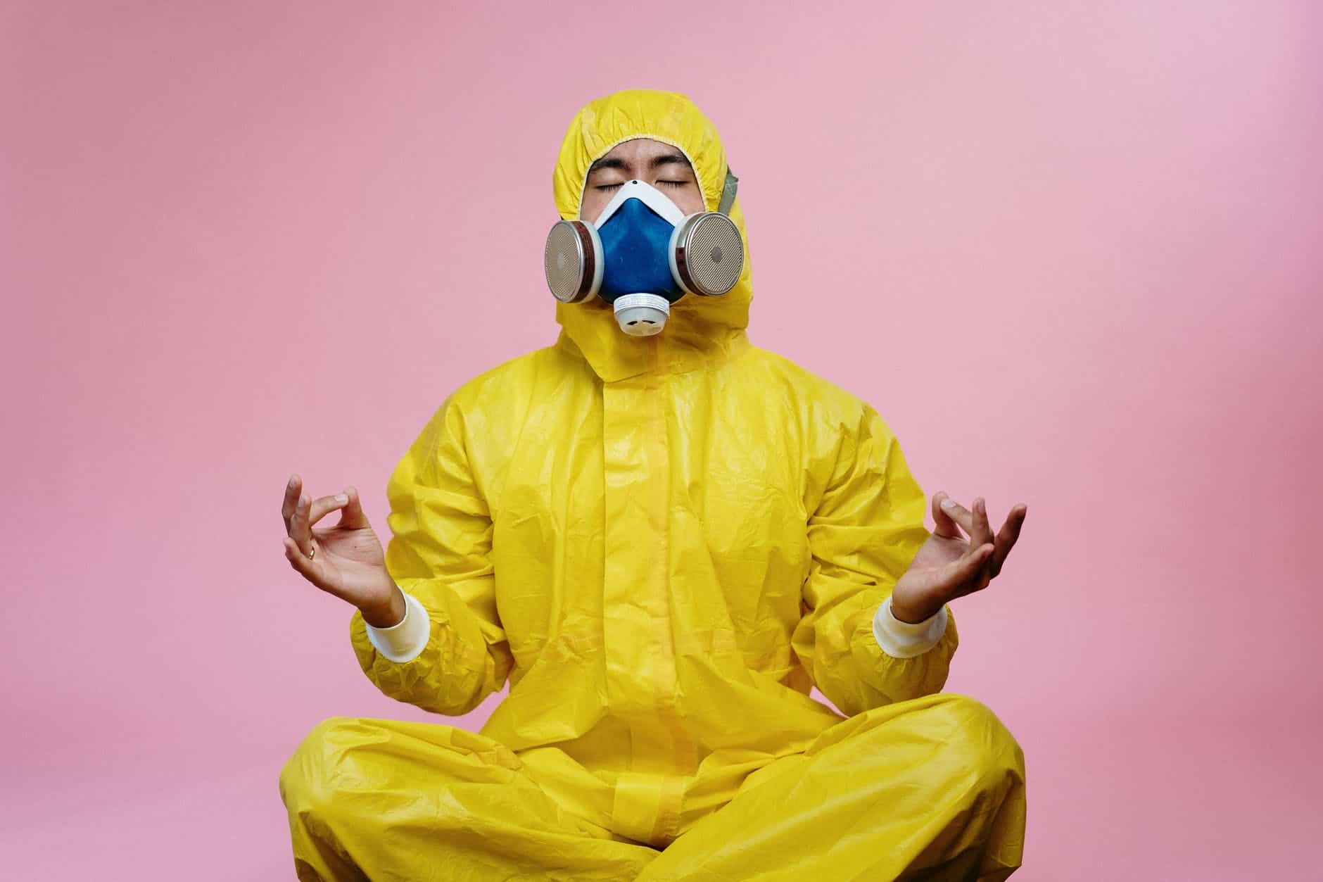 Protective suit and mask for safety in hazardous environments, emphasizing conflict and crisis manag.
