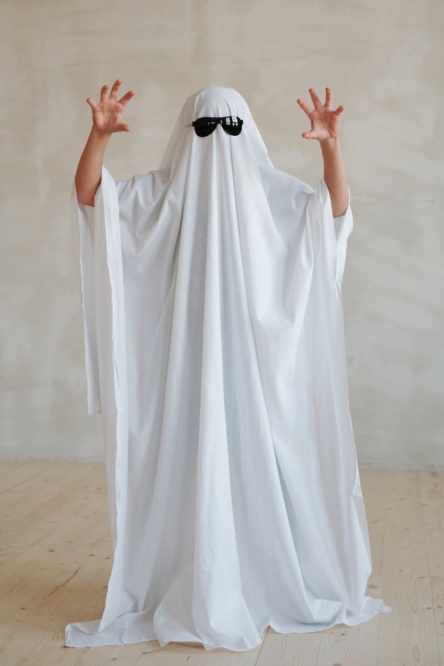 Ghost costume with sunglasses for Halloween or ghost-themed events.