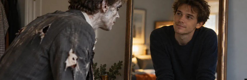 Man looking at his reflection in a mirror with a bruised, zombie-like face.